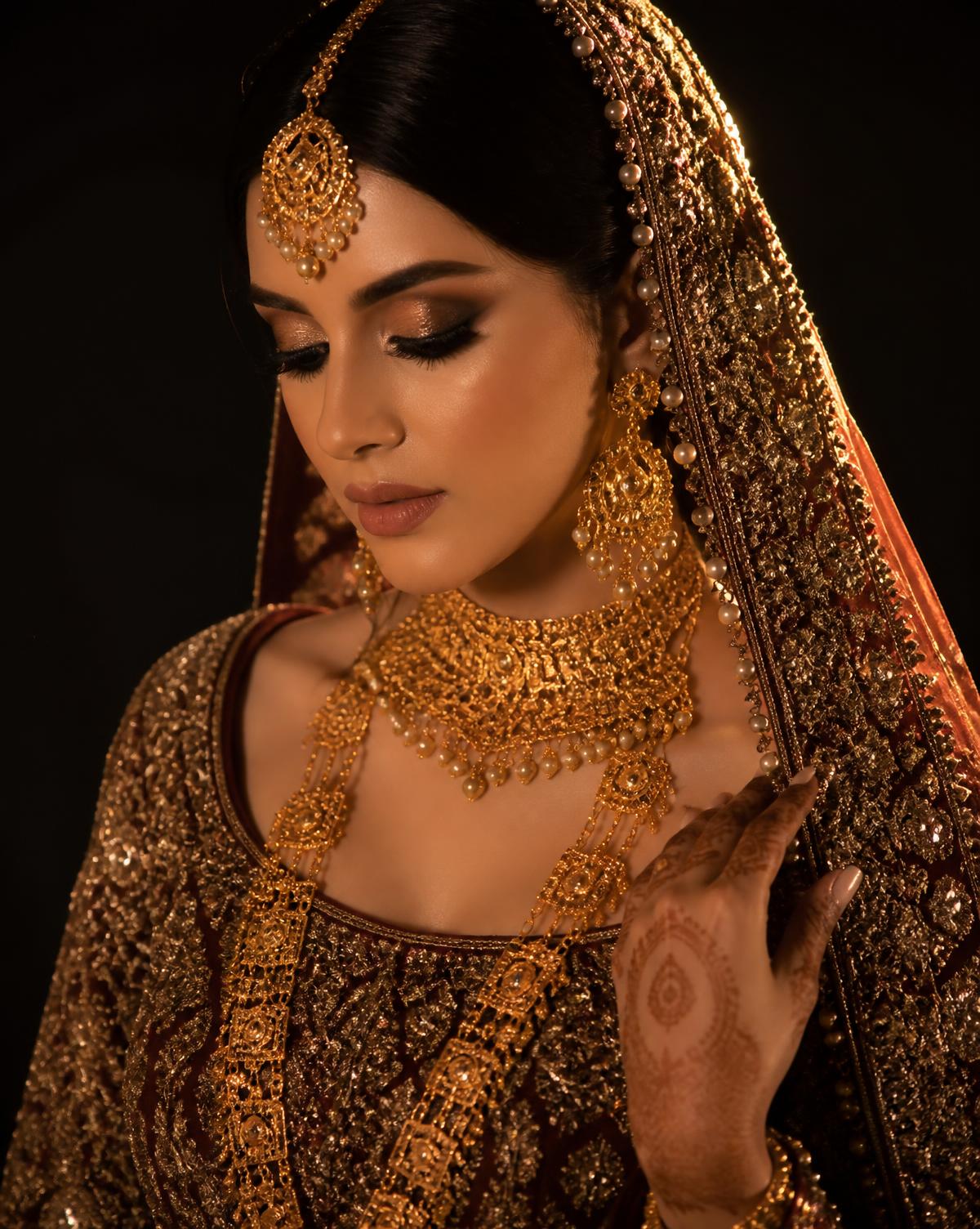 Bride wearing a handcrafted 21K gold Sidra bridal set